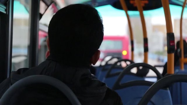 Young boy going School bus
