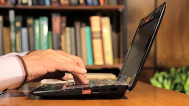 Man type something with his laptop