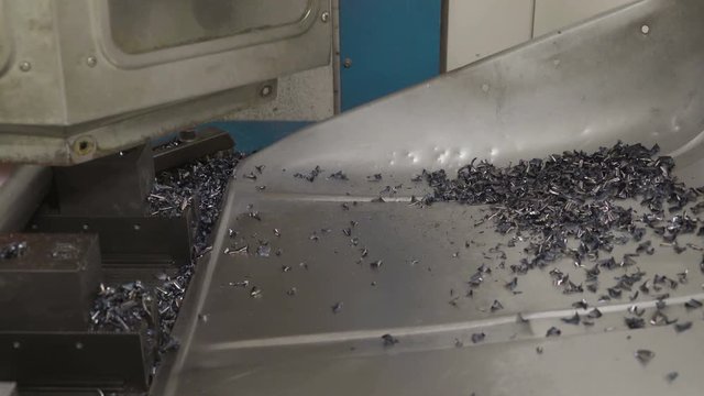 The tiny scrapes from the metal milling. These tiny metals are to be cleaned by a machine