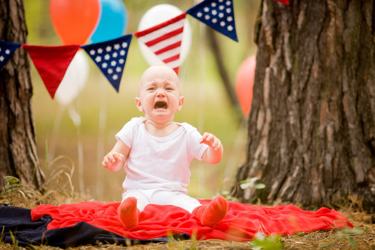 4th of july holiday: happy children with American flag 