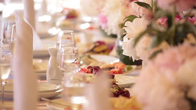 The elegant wedding or birthday dinner table with flowers, close up