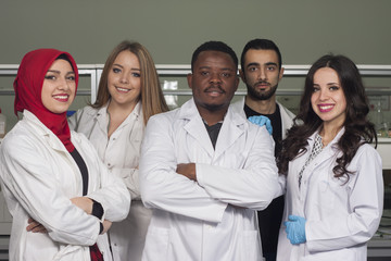 Fototapeta premium Group of young medical workers are working in lab as lab technicians