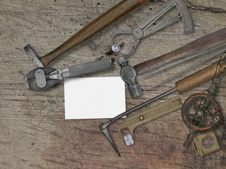 vintage jeweler tools over wooden bench