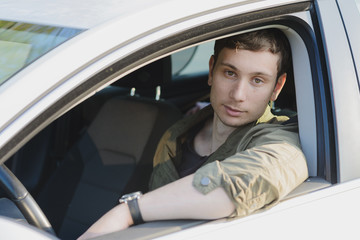 Handsome man in white car