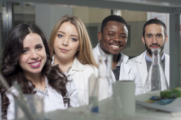 Group of young medical workers are working in lab as lab technic