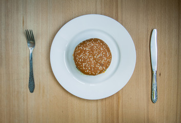 Fast food set big hamburger and french fries on wood background