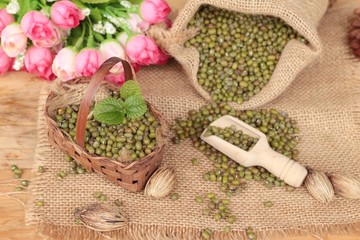 Green beans dry on wood background.