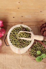 Green beans dry on wood background.