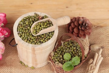 Green beans dry on wood background.