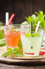 Mix of cocktails with rum and mint on the wooden table