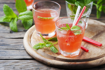 Fresh alcohol cocktail with rum, berry and mint