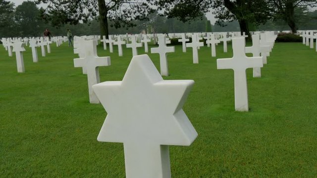 A star signed cross in Normandy Cemetery this signifies the jewish people who are buried there