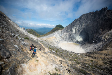 traveller trekking to top of sibayak mountain,indonesia