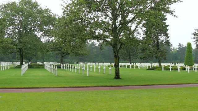 Landscape view of the Normandy American Cemetery in France where all crosses are in colored white