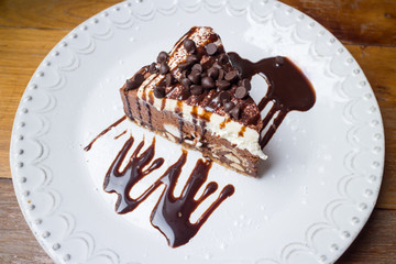 Sweet chocolate ship cake with syrup on the dish