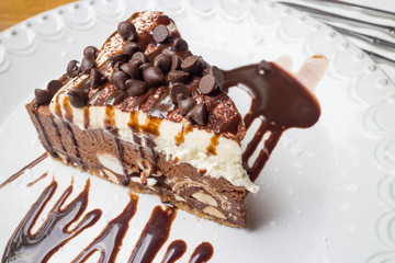 Sweet chocolate ship cake with syrup on the dish