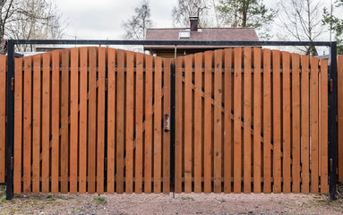 Fototapeta premium brown wooden gate in the village