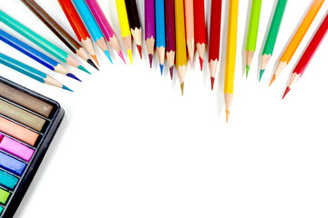 Fototapeta premium Multicolor colored pencils or crayons in white background.