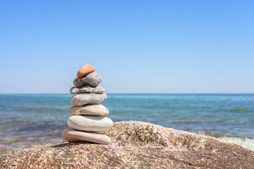 Stones on a beach, balance and harmony concept background, shallow depth of field.