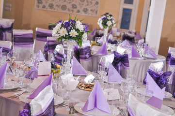 Wedding table with plate, napkin, cutlery on mauve color