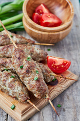 Minced lamb kebab with vegetables