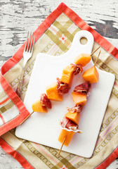 light meal: skewers of melon and parma ham