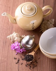 Top view on wooden board with tea set