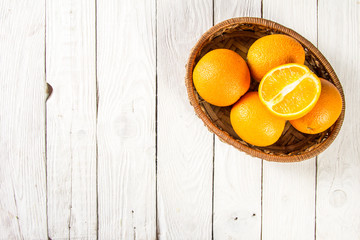 Oranges in a basket on table