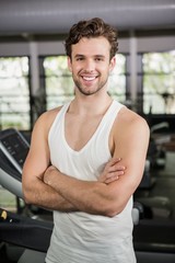 Fototapeta na wymiar Handsome man standing in gym