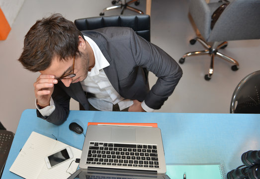 Portrait of smiling Businessman posing  in coworking office