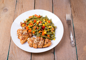 Mixed vegetables in a plate and chicken