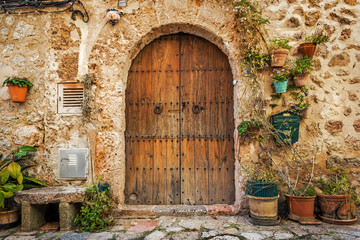 Fototapeta na wymiar Doorway of traditional stone finca house in Valldemossa
