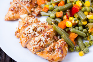Mixed vegetables in a plate and chicken