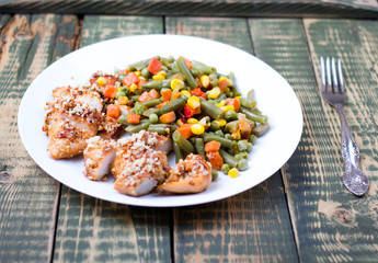 Mixed vegetables in a plate and chicken