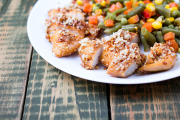 Mixed vegetables in a plate and chicken