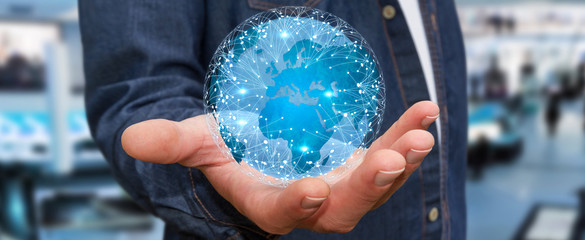 Businessman connecting different places of the world