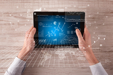 Business hands holding tablet