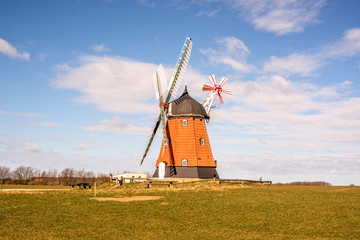 Old mill on a green meadow