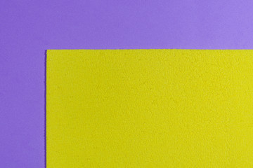 Eva foam ethylene vinyl acetate sponge plush lemon yellow surface on light purple smooth background