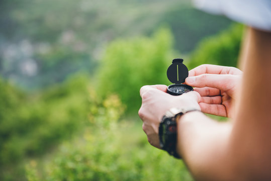 Man holding a compass