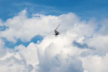 Helicopter in the blue sky