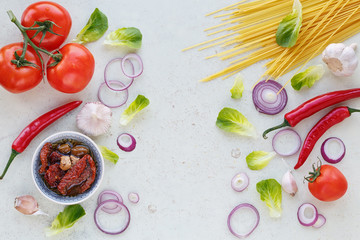 Organic clean vegetables assorted with oil on white wooden backg