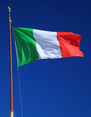 Italian flag in front of blue sky