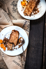 Two slices of pie on wooden background