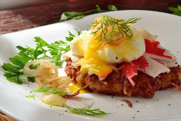  potato pancakes with poached egg and crab sticks