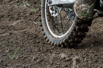 Rear wheel motocross bike on the background of the track