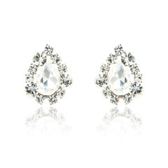 Pair of diamond earrings isolated on white