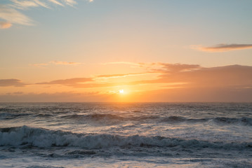 Ocean sunset blue orange rough seas waves dusk dawn sea