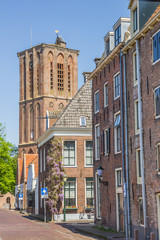 Fototapeta na wymiar Church tower in a street in historical Elburg