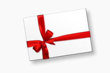 White gift box with red ribbon bow, isolated on white